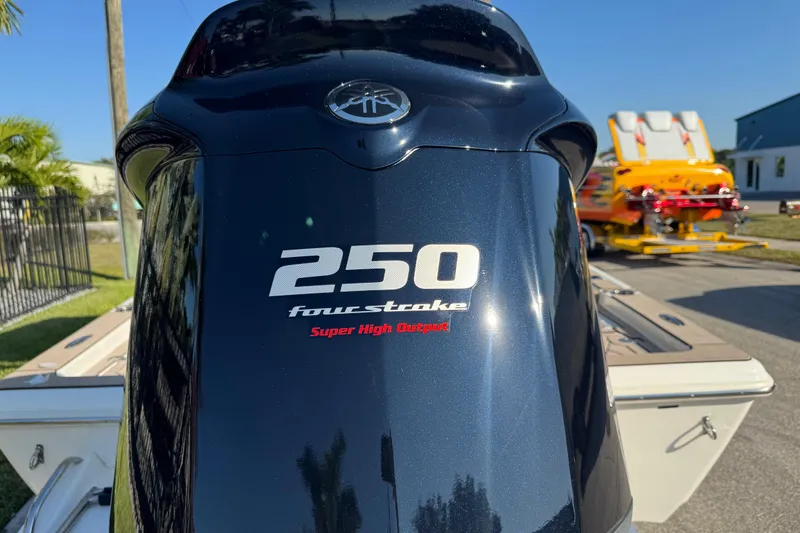 Slide: The Image of 2019 Key West 230 Bay Reef with 250 four-stroke outboard engine, outdoor setting. - 9