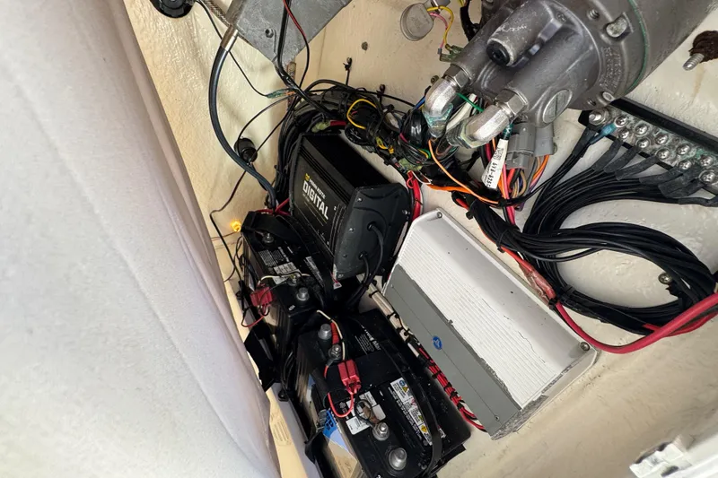 Slide: The Image of Electrical system of a 2019 Key West 230 Bay Reef boat, featuring batteries and wiring. - 96