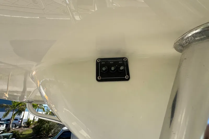 Slide: The Image of Control panel on a 2019 Key West 230 Bay Reef boat, featuring accessory switches. - 97
