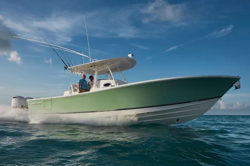 Slide: The Image of 2019 Regulator 34SS boat dashboard with navigation screens and steering wheel. - 11