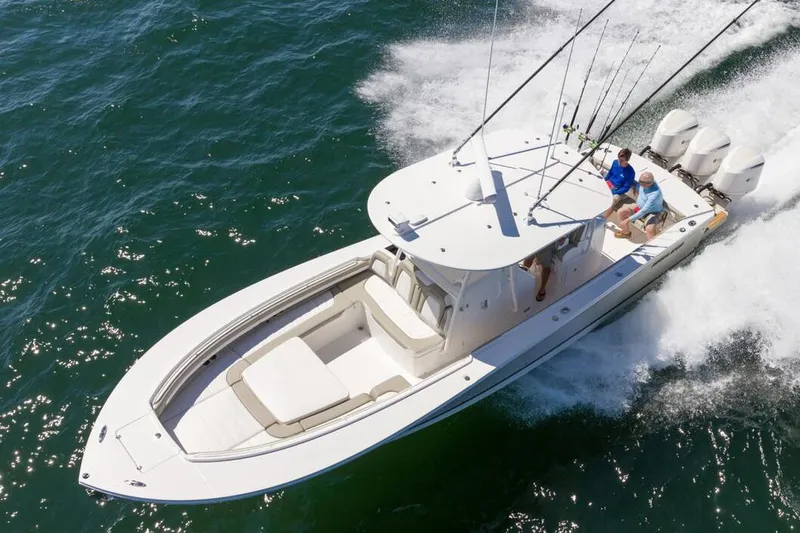 Slide: The Image of Control panel of 2019 Regulator 34SS boat with navigation screens and steering wheel. - 13