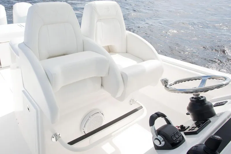 Slide: The Image of 2019 Regulator 34SS boat interior with open storage compartments and seating area. - 19