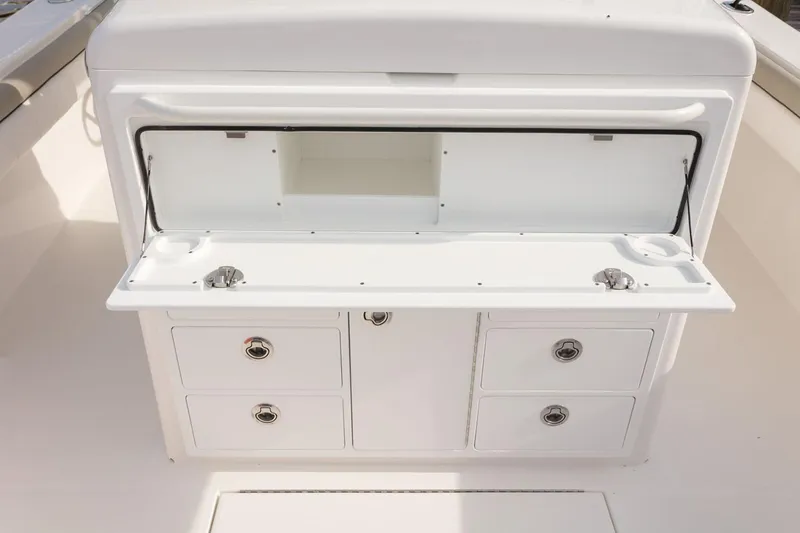 Slide: The Image of 2019 Regulator 34SS boat deck with storage compartments and seating. - 22