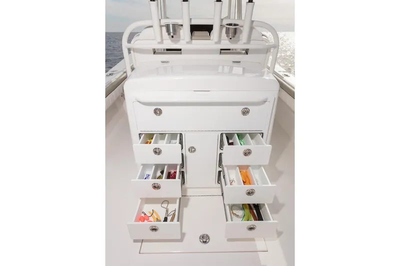 Slide: The Image of 2019 Regulator 34SS boat interior with white seating and storage compartments. - 23