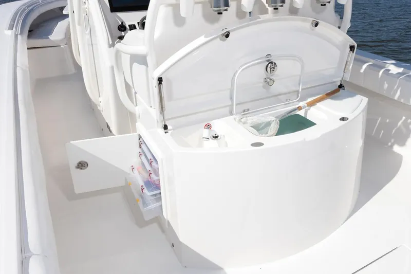 Slide: The Image of 2019 Regulator 34SS boat interior with white seating and storage compartments. - 24