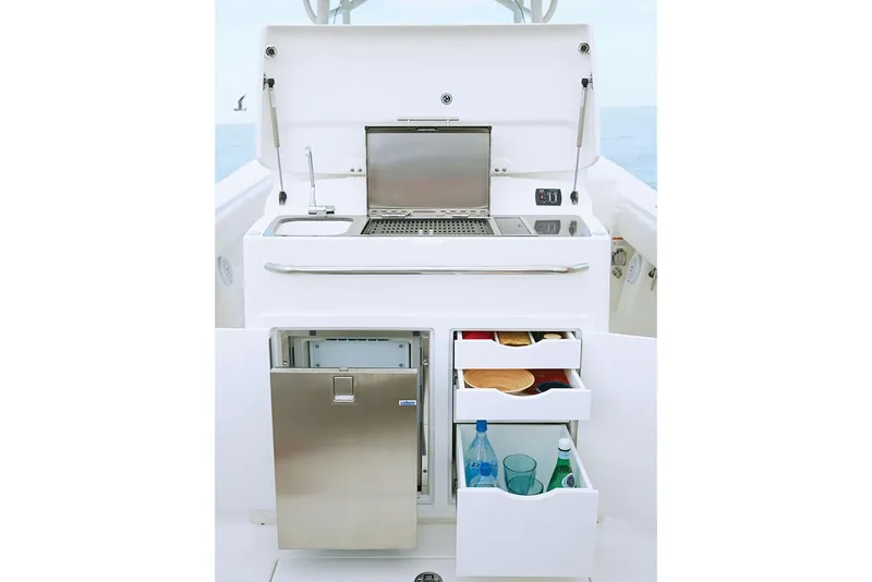 Slide: The Image of 2019 Regulator 34SS boat interior with white seating and table. - 25