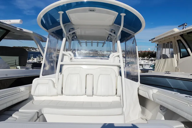 Slide: The Image of 2019 Regulator 34SS boat with triple Yamaha outboard engines at dock. - 37
