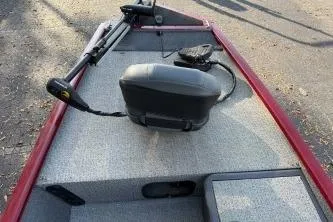 Slide: The Image of 2020 Tracker Pro 160 boat interior with steering console and seating. - 5