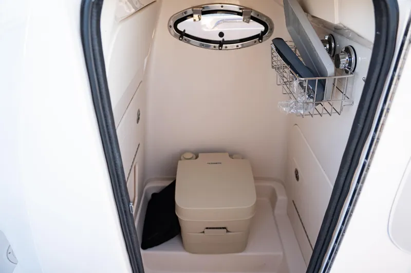 Slide: The Image of 2018 Grady-White Fisherman 236 boat interior with compact marine toilet. - 11