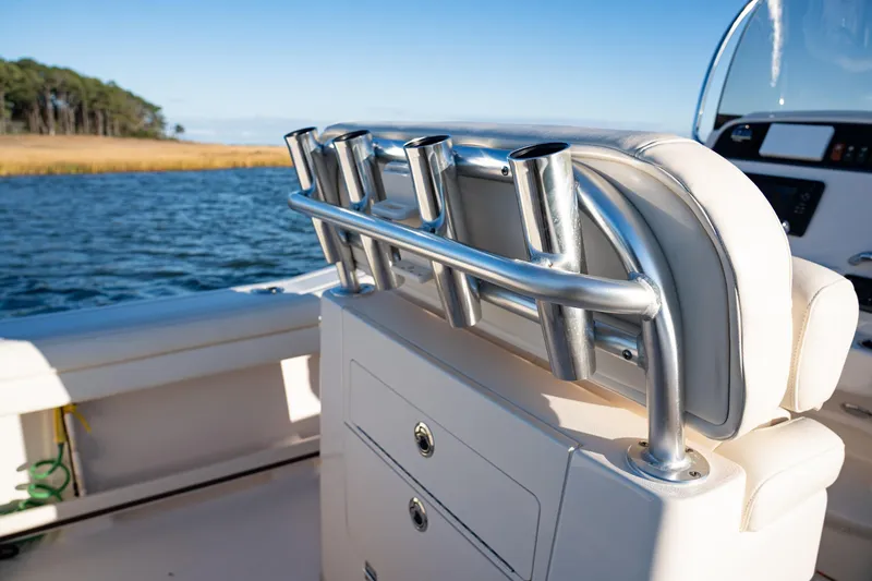 Slide: The Image of 2018 Grady-White Fisherman 236 boat with rod holders on a sunny day. - 17