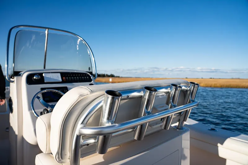 Slide: The Image of 2018 Grady-White Fisherman 236 boat console with rod holders on a sunny day. - 18