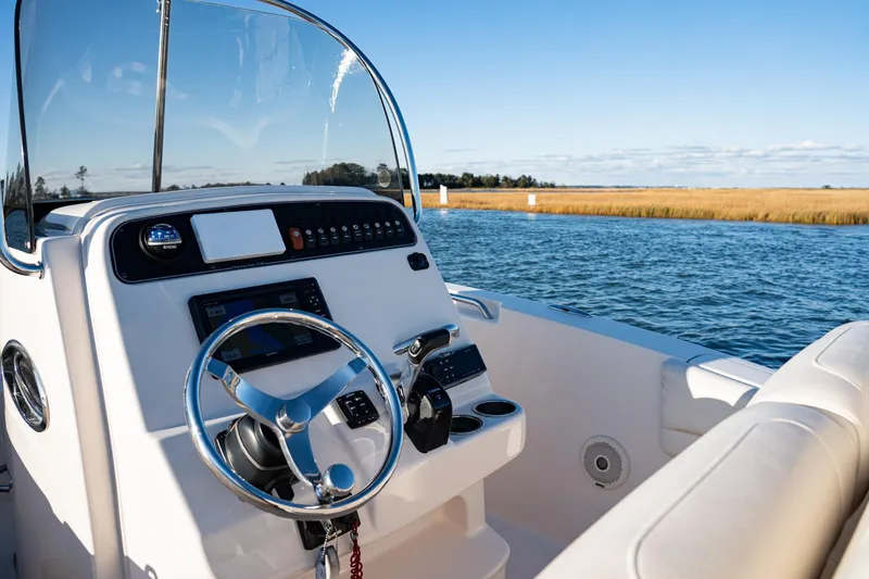 Slide: The Image of 2018 Grady-White Fisherman 236 boat dashboard with scenic water view. - 6