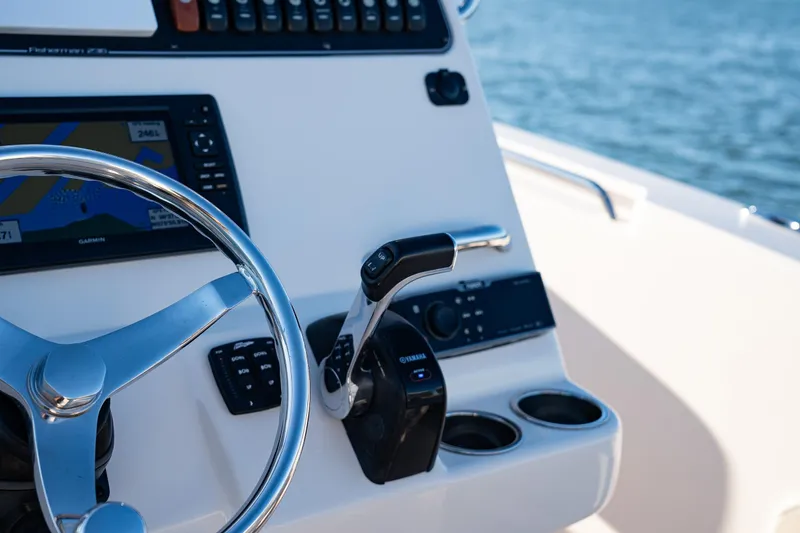 Slide: The Image of 2018 Grady-White Fisherman 236 helm with Garmin navigation and Yamaha controls. - 7