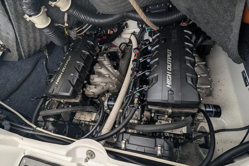 Slide: The Image of Engine compartment of a 2017 Yamaha 242 Limited S boat, featuring dual high-output engines. - 10