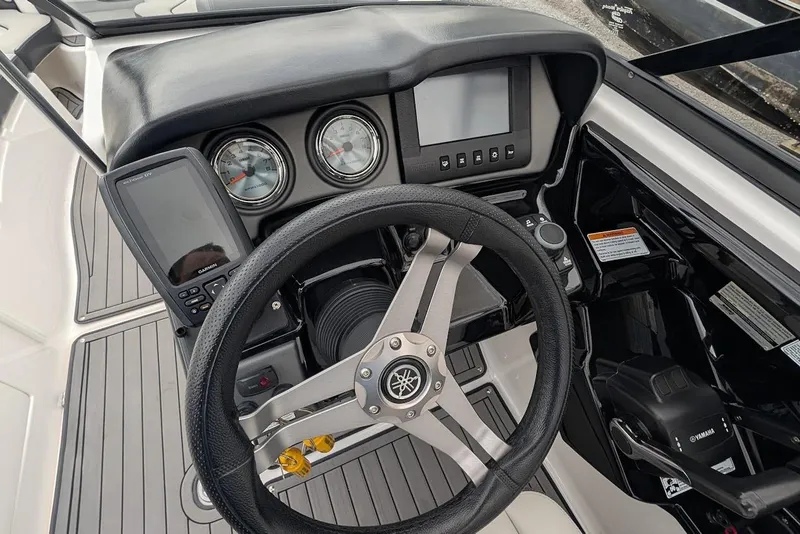 Slide: The Image of 2017 Yamaha 242 Limited S dashboard with steering wheel and controls. - 12