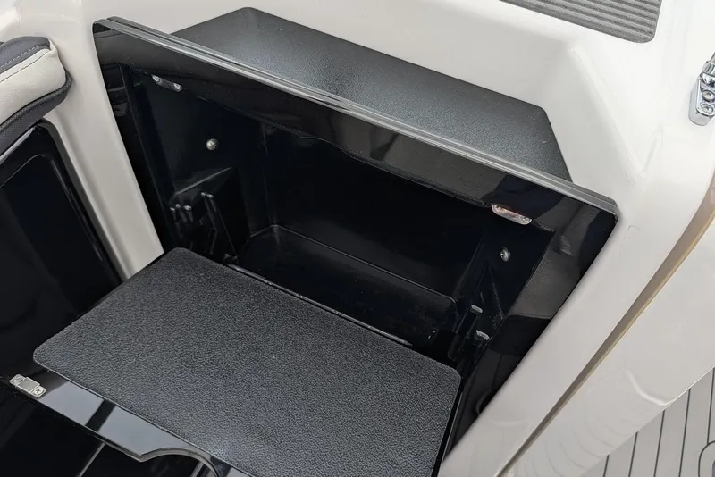 Slide: The Image of Open storage compartment on a 2017 Yamaha 242 Limited S boat. - 17