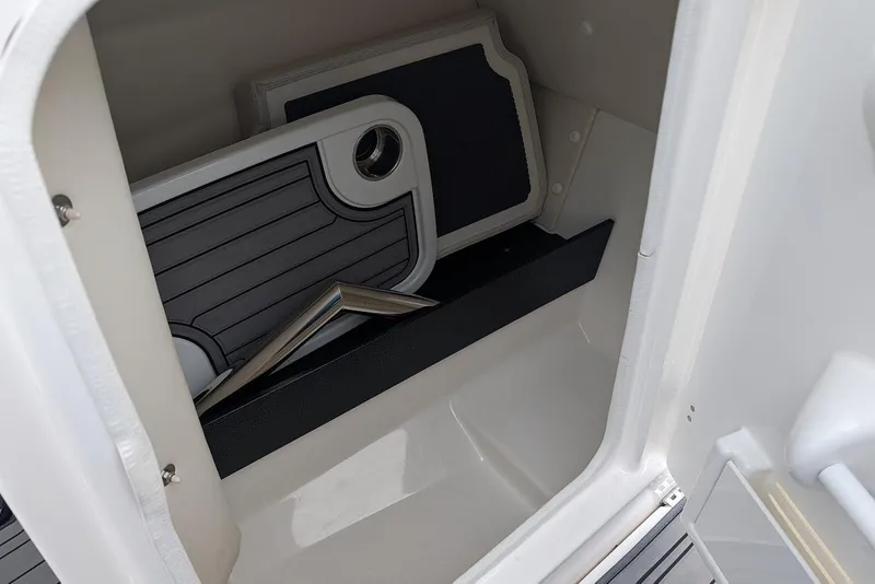 Slide: The Image of Storage compartment in 2017 Yamaha 242 Limited S boat with accessories. - 18