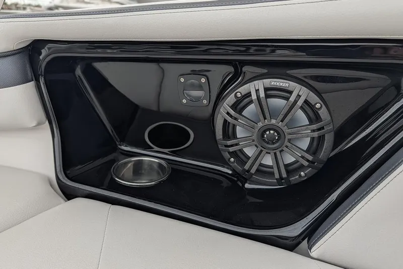 Slide: The Image of 2017 Yamaha 242 Limited S boat interior with Kicker speaker and cup holder. - 21