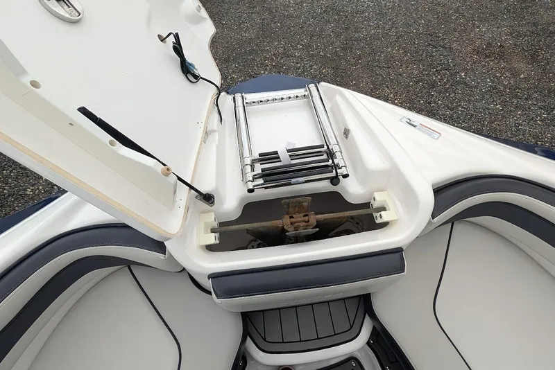 Slide: The Image of 2017 Yamaha 242 Limited S boat anchor storage compartment with open hatch. - 23