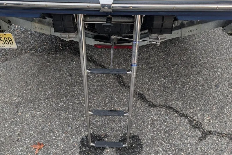 Slide: The Image of Rear view of a 2017 Yamaha 242 Limited S boat with a metal boarding ladder. - 24