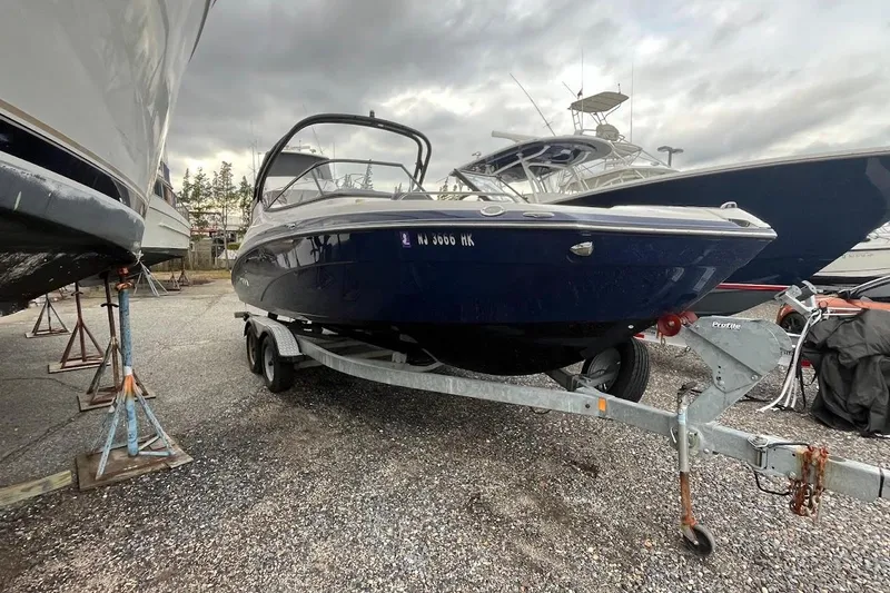 Slide: The Image of 2017 Yamaha 242 Limited S boat on trailer under cloudy sky. - 3