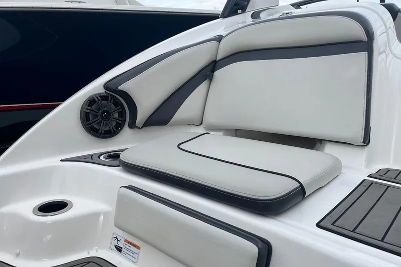 Slide: The Image of 2017 Yamaha 242 Limited S boat interior with cushioned seating and speaker. - 5