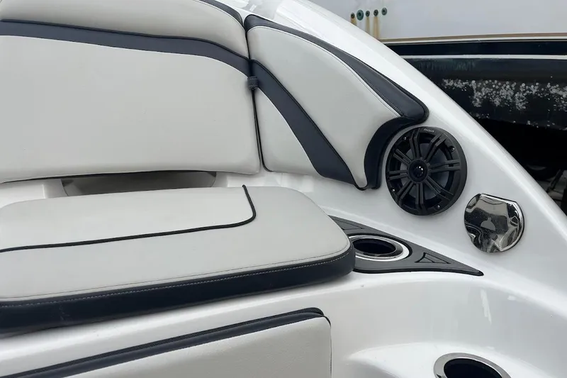 Slide: The Image of 2017 Yamaha 242 Limited S boat interior with cushioned seating and speaker system. - 6