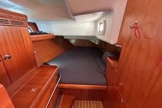 Slide: The Image of Cozy cabin interior of 2005 Elan 40 sailboat with wooden furnishings. - 18