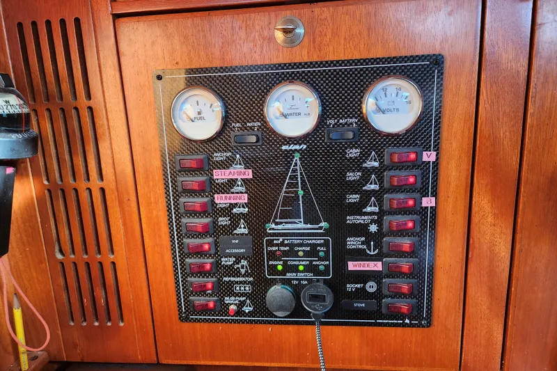 Slide: The Image of Control panel of a 2005 Elan 40 yacht with gauges and switches. - 22