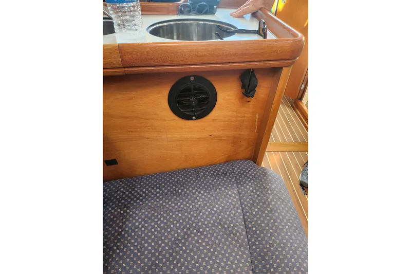 Slide: The Image of Interior of 2005 Elan 40 yacht with wooden cabinetry and upholstered seating. - 28