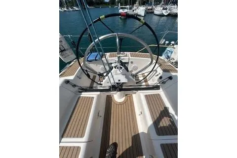 Slide: The Image of Cockpit view of a 2005 Elan 40 sailboat with dual steering wheels. - 3