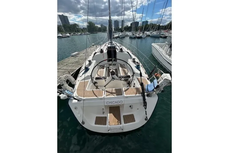Slide: The Image of 2005 Elan 40 sailboat docked in Chicago marina under cloudy sky. - 4