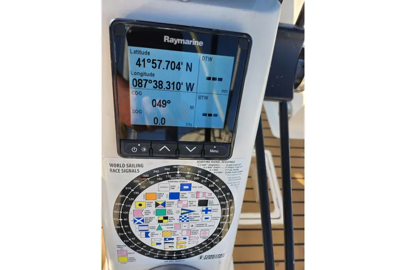Slide: The Image of Raymarine navigation display on 2005 Elan 40 sailboat, showing coordinates and sailing signals. - 6
