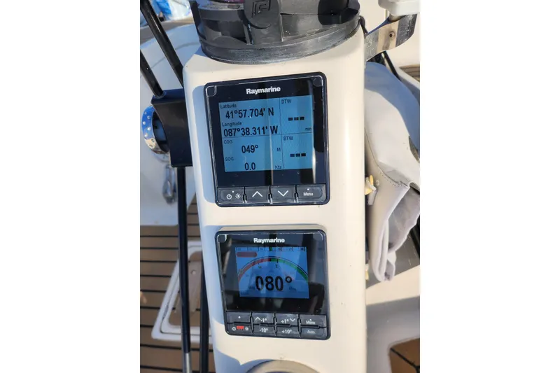 Slide: The Image of Raymarine navigation display on 2005 Elan 40 sailboat, showing coordinates and heading. - 7