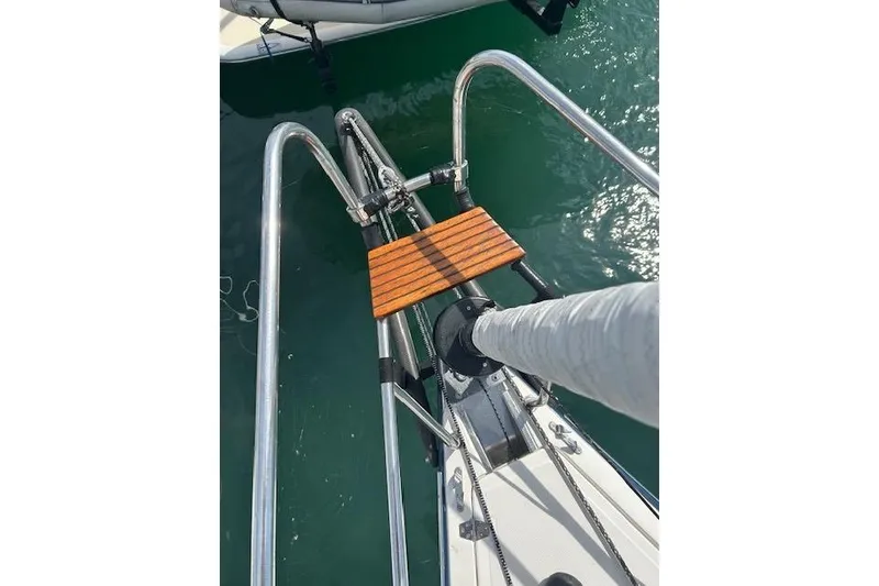 Slide: The Image of Bow of 2005 Elan 40 sailboat with stainless steel rails and wooden step. - 9