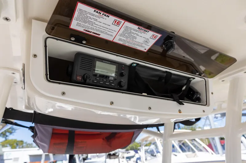 Slide: The Image of 2018 Ranger 2510 Bay Ranger boat console with Garmin radio and safety instructions. - 10