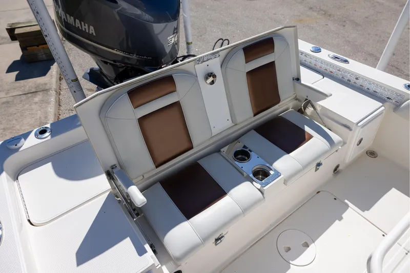 Slide: The Image of 2018 Ranger 2510 Bay Ranger boat seating with cup holders and Yamaha engine. - 19