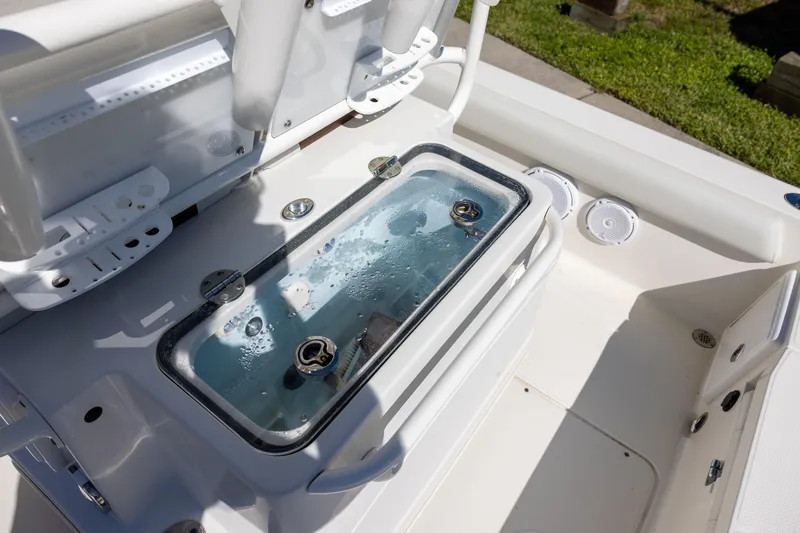 Slide: The Image of 2018 Ranger 2510 Bay Ranger boat with livewell and rod holders on deck. - 8