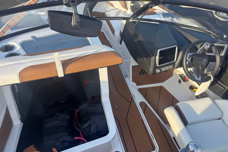 Slide: The Image of 2025 Malibu Response TXi boat interior with modern dashboard and seating. - 10