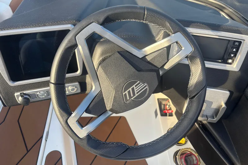 Slide: The Image of 2025 Malibu Response TXi steering wheel and dashboard close-up. - 11
