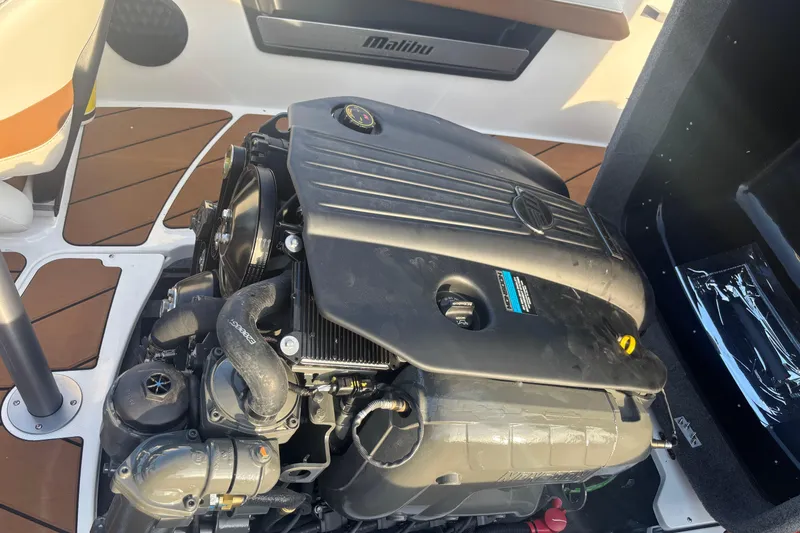 Slide: The Image of 2025 Malibu Response TXi boat engine, showcasing detailed components and sleek design. - 12