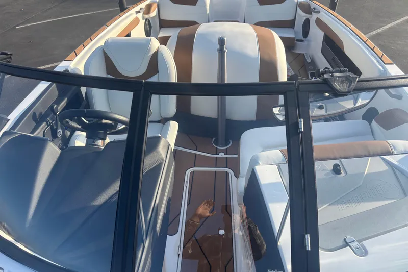 Slide: The Image of 2025 Malibu Response TXi boat interior with sleek design and modern features. - 9