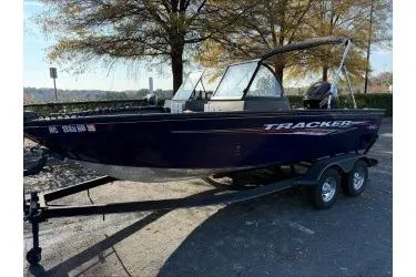 Slide: The Image of 2023 Tracker Pro Guide V-175 WT boat on trailer, parked outdoors. - 3