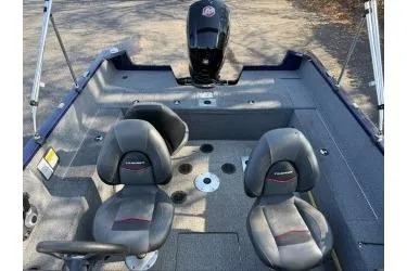 Slide: The Image of 2023 Tracker Pro Guide V-175 WT boat interior with seating and motor. - 5