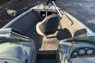 Slide: The Image of 2007 Lund 1775 Classic Sport boat interior with seating and control panel. - 3