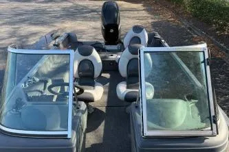 Slide: The Image of 2007 Lund 1775 Classic Sport boat interior with seating and windshield. - 4