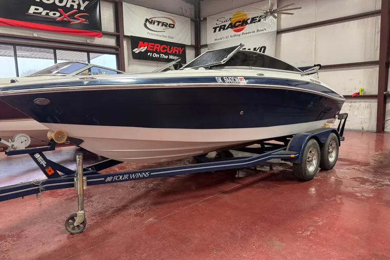 The Image of 2005 Four Winns 190 Horizon LE boat on trailer in showroom. - 1