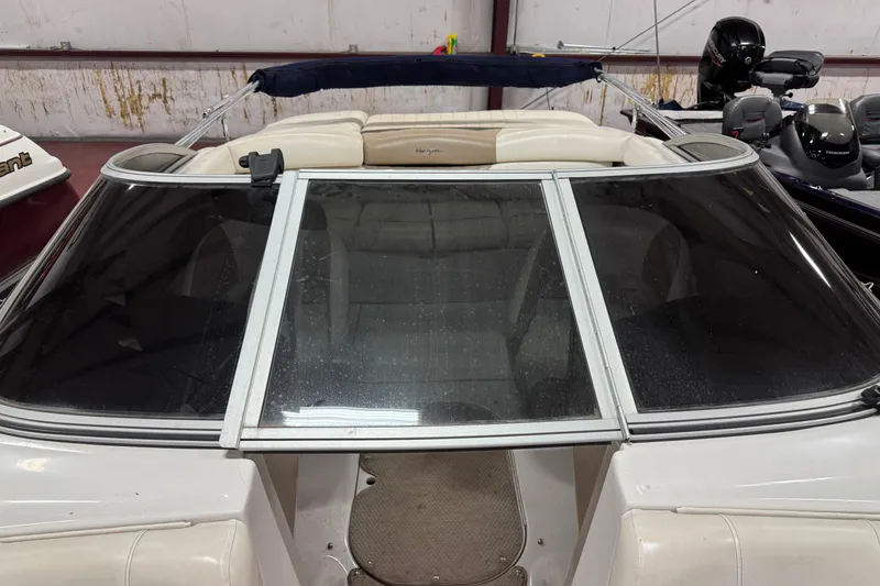 Slide: The Image of 2005 Four Winns 190 Horizon LE boat with windshield and beige interior. - 5
