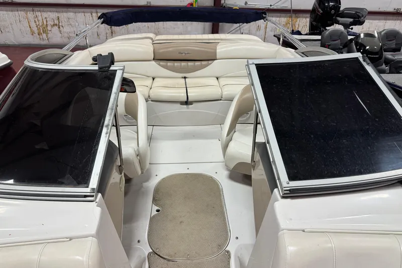 Slide: The Image of 2005 Four Winns 190 Horizon LE boat interior with white seating and dual windshields. - 6