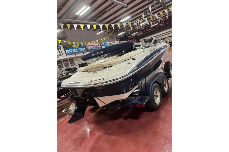 Slide: The Image of 2005 Four Winns 190 Horizon LE boat on trailer in showroom. - 8